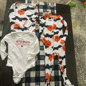 Lot of three Carters Halloween body suits only worn once a piece.